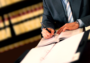 man writing in book