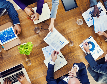 meeting at a table going over documents